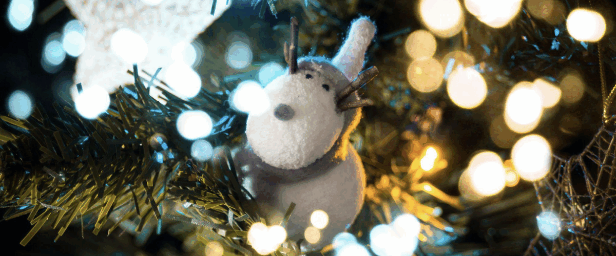 Discover tips for choosing an artificial Christmas tree and how it embodies family, kindness, and holiday joy.