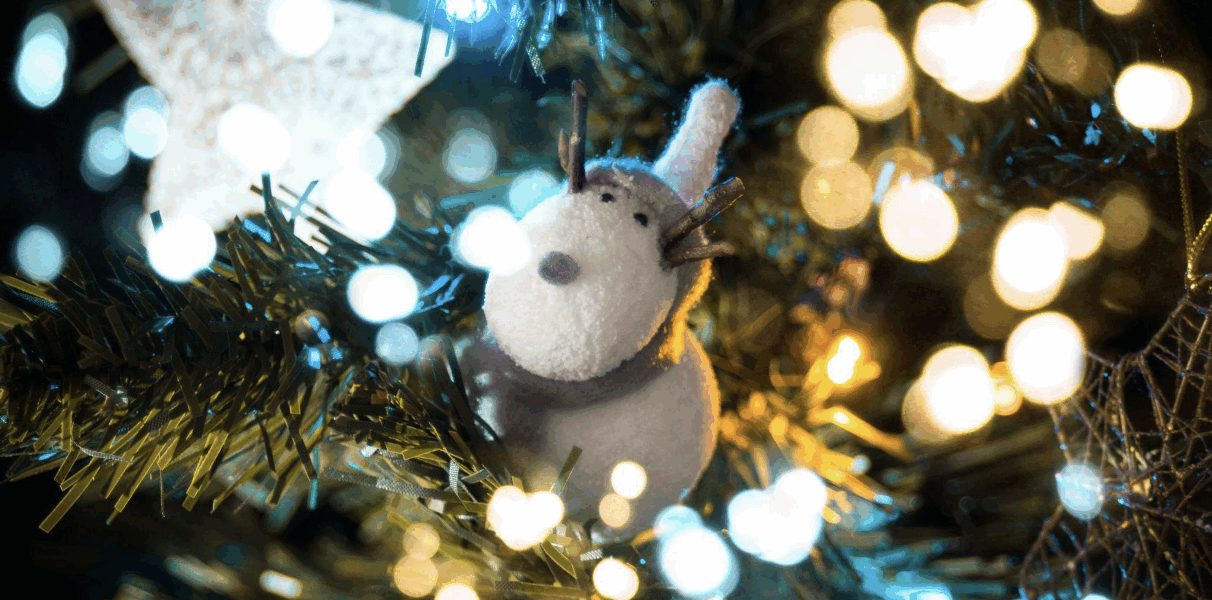 Discover tips for choosing an artificial Christmas tree and how it embodies family, kindness, and holiday joy.