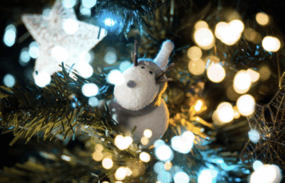 Discover tips for choosing an artificial Christmas tree and how it embodies family, kindness, and holiday joy.