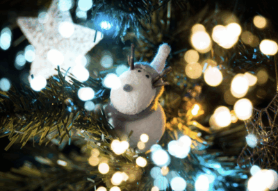 Discover tips for choosing an artificial Christmas tree and how it embodies family, kindness, and holiday joy.